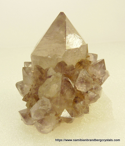 Light smoky cactus quartz crystal with faint amethyst colouring
