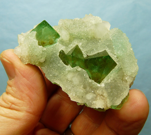 Well-formed green fluorite pyramids with quartz