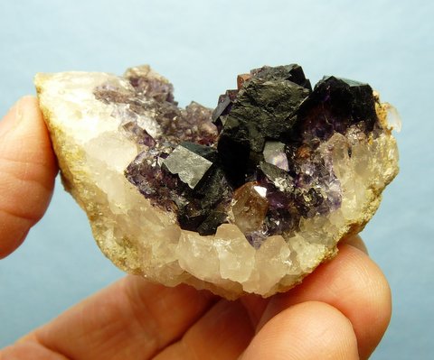 Dark purple fluorite crystals on matrix