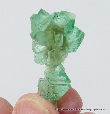 Green fluorite crystal group with minute pyrite inclusions