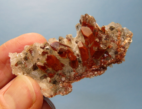 Group of quartz crystals with lovely red / brown phantoms
