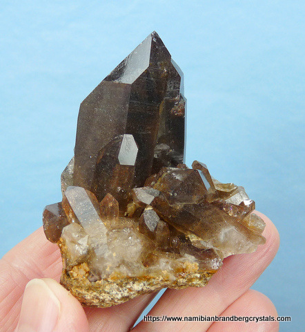 Smoky quartz crystals with hematite inclusions