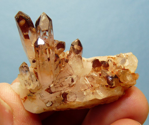 Hematite coated phantom quartz crystals on matrix