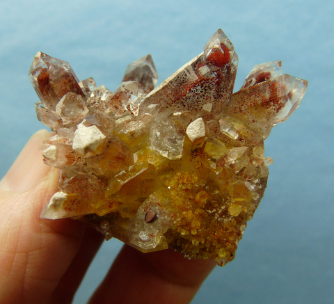 Quartz crystal group with bright red and speckled phantoms