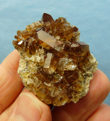 Quartz crystals with brownish hematite colouring, on matrix