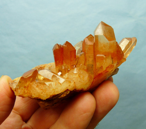 Quartz crystals with orangy-brown hematite coating, on matrix