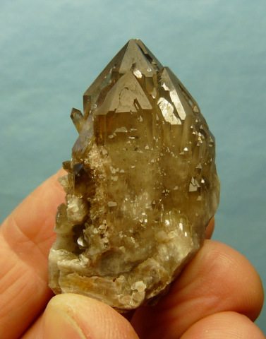 Quartz crystals with orangy-brown hematite colouring, on matrix