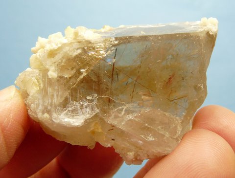 Light smoky quartz crystal with feldspar, dolomite and rutile