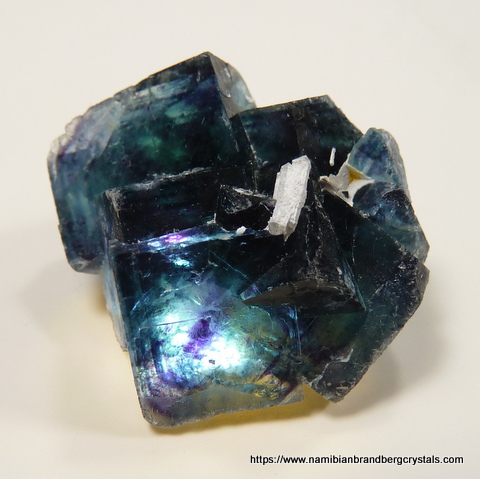 Blue-green fluorite crystal group with light from behind Blue-green fluorite crystal group with light from behind